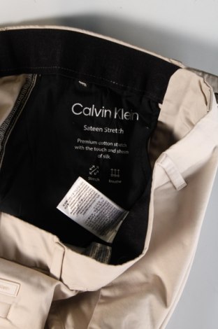 Męskie spodnie Calvin Klein, Rozmiar M, Kolor Beżowy, Cena 569,99 zł