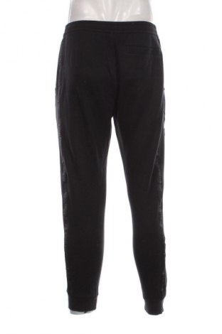 Pantaloni trening de bărbați Calvin Klein Jeans, Mărime M, Culoare Negru, Preț 201,99 Lei