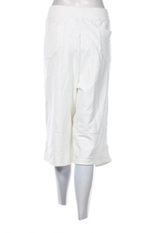 Damskie spodnie sportowe Nike, Rozmiar XL, Kolor ecru, Cena 213,79 zł