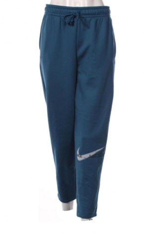 Damskie spodnie sportowe Nike, Rozmiar M, Kolor Niebieski, Cena 134,99 zł