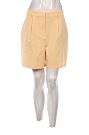 Γυναικείο κοντό παντελόνι Guido Maria Kretschmer for About You, Μέγεθος L, Χρώμα Κίτρινο, Τιμή 13,89 €