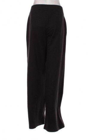 Pantaloni trening de femei Calvin Klein Jeans, Mărime L, Culoare Negru, Preț 513,16 Lei