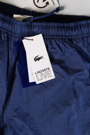 Męskie spodnie sportowe Lacoste, Rozmiar M, Kolor Niebieski, Cena 171,99 zł