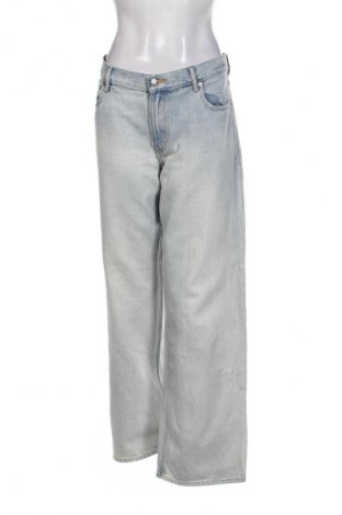 Damskie jeansy H&M, Rozmiar L, Kolor Niebieski, Cena 67,00 zł