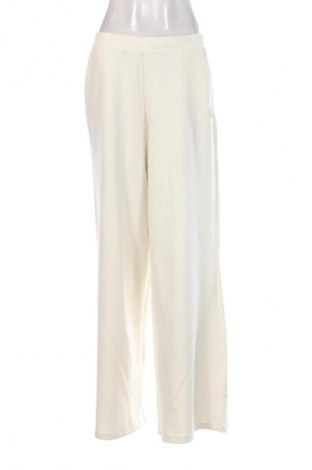 Damskie spodnie Guess, Rozmiar L, Kolor ecru, Cena 564,99 zł