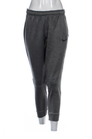 Damskie spodnie sportowe Nike, Rozmiar M, Kolor Szary, Cena 86,99 zł