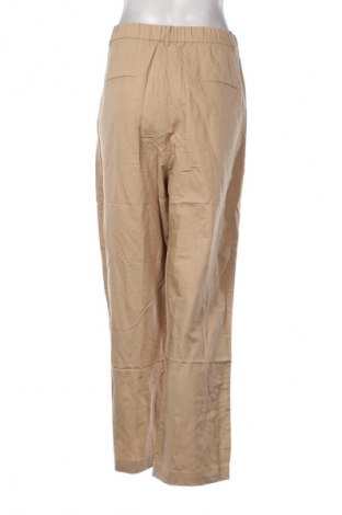 Damskie spodnie Uniqlo, Rozmiar L, Kolor Beżowy, Cena 134,99 zł
