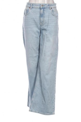 Damskie jeansy H&M, Rozmiar L, Kolor Niebieski, Cena 66,67 zł