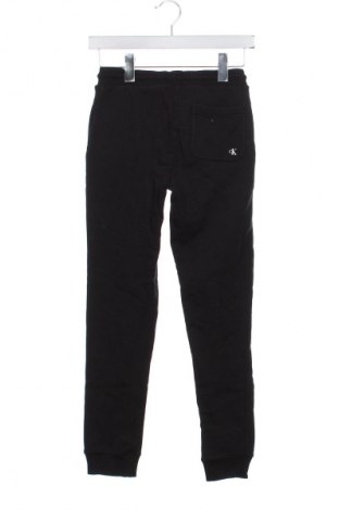 Детско спортно долнище Calvin Klein Jeans, Размер 11-12y/ 152-158 см, Цвят Черен, Цена 76,99 лв.
