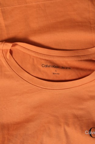 Γυναικείο t-shirt Calvin Klein Jeans, Μέγεθος L, Χρώμα Πορτοκαλί, Τιμή 25,99 €