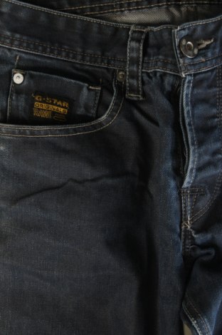 Męskie jeansy G-Star Raw, Rozmiar M, Kolor Niebieski, Cena 64,99 zł