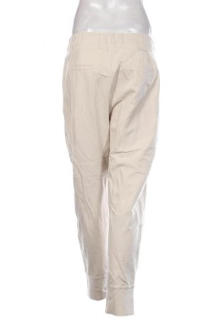 Pantaloni trening de femei Unbranded, Mărime XL, Culoare Bej, Preț 100,99 Lei