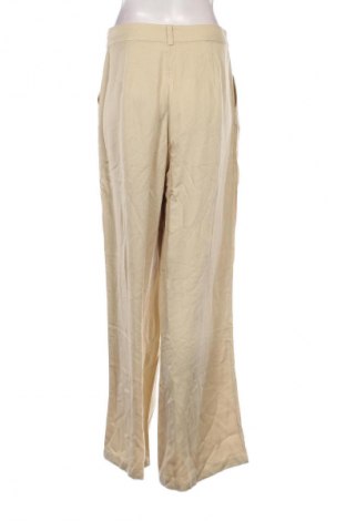 Damenhose Guido Maria Kretschmer for About You, Größe M, Farbe Beige, Preis 11,49 €