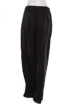 Pantaloni de femei Guido Maria Kretschmer for About You, Mărime L, Culoare Negru, Preț 107,99 Lei