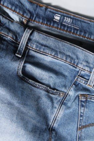 Męskie jeansy G-Star Raw, Rozmiar L, Kolor Niebieski, Cena 307,49 zł