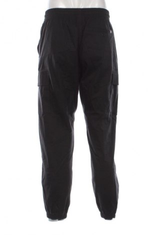 Pánske nohavice  New Balance, Veľkosť M, Farba Čierna, Cena  75,32 €