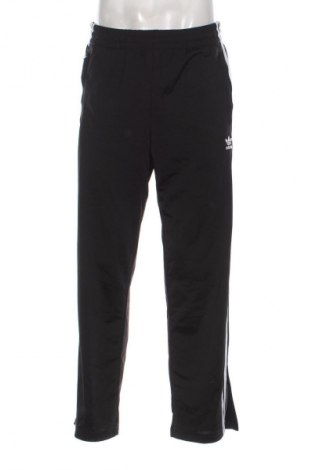 Męskie spodnie sportowe Adidas, Rozmiar M, Kolor Czarny, Cena 107,99 zł