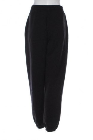 Damen Sporthose Guess, Größe L, Farbe Schwarz, Preis 29,16 €