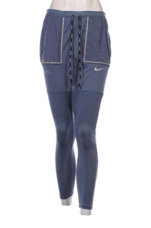 Pantaloni de femei Nike, Mărime M, Culoare Albastru, Preț 117,99 Lei