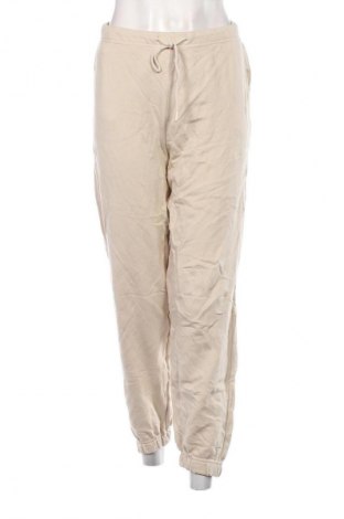 Pantaloni trening de femei Stradivarius, Mărime XL, Culoare Bej, Preț 100,99 Lei