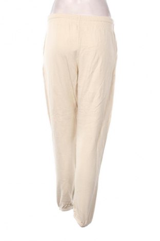 Damskie spodnie sportowe Uniqlo, Rozmiar L, Kolor Beżowy, Cena 111,99 zł
