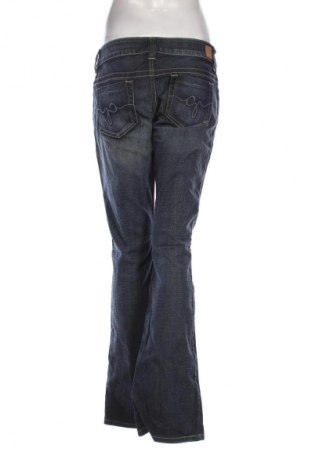 Damskie jeansy Guess, Rozmiar L, Kolor Niebieski, Cena 172,41 zł
