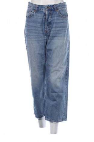 Damskie jeansy H&M, Rozmiar L, Kolor Niebieski, Cena 66,39 zł