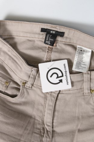 Damskie jeansy H&M, Rozmiar XS, Kolor Beżowy, Cena 92,76 zł