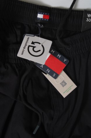 Męskie spodnie Tommy Jeans, Rozmiar S, Kolor Niebieski, Cena 322,99 zł