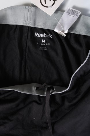 Męskie spodnie sportowe Reebok, Rozmiar M, Kolor Czarny, Cena 146,99 zł