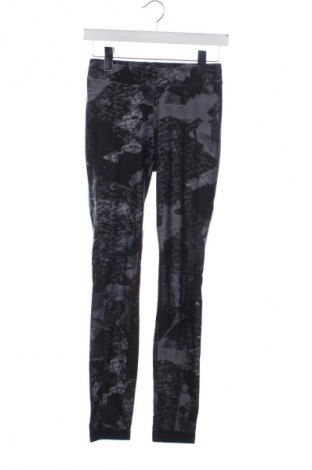 Damskie legginsy Decathlon, Rozmiar XS, Kolor Kolorowy, Cena 59,77 zł