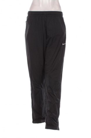 Damskie spodnie sportowe Nike, Rozmiar M, Kolor Szary, Cena 161,99 zł