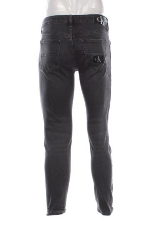 Męskie jeansy Calvin Klein Jeans, Rozmiar M, Kolor Czarny, Cena 107,99 zł