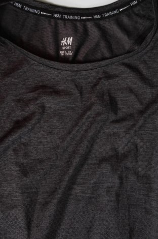 Dámský sportovní top  H&M, Velikost L, Barva Vícebarevné, Cena  129,00 Kč