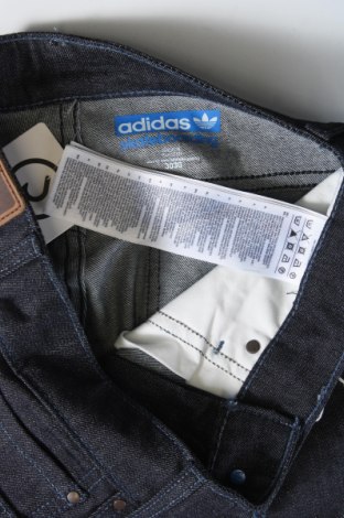 Męskie jeansy Adidas Originals, Rozmiar S, Kolor Niebieski, Cena 108,99 zł