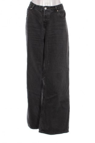 Damskie jeansy H&M, Rozmiar L, Kolor Czarny, Cena 124,92 zł