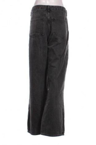Damskie jeansy H&M, Rozmiar L, Kolor Czarny, Cena 124,92 zł