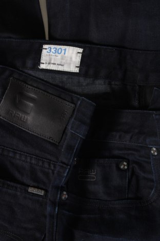 Męskie jeansy G-Star Raw, Rozmiar L, Kolor Niebieski, Cena 307,99 zł