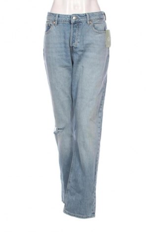 Damskie jeansy H&M, Rozmiar L, Kolor Niebieski, Cena 105,70 zł