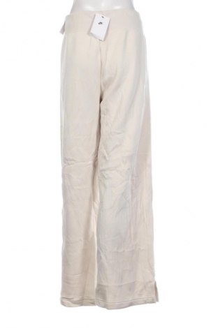 Дамско спортно долнище Nike, Размер XXL, Цвят Бежов, Цена 65,99 лв.