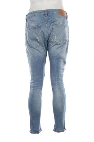 Męskie jeansy Bershka, Rozmiar L, Kolor Niebieski, Cena 90,99 zł