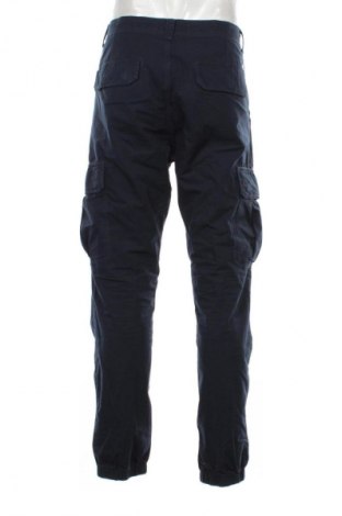 Pánske nohavice  Tommy Jeans, Veľkosť L, Farba Modrá, Cena  107,95 €