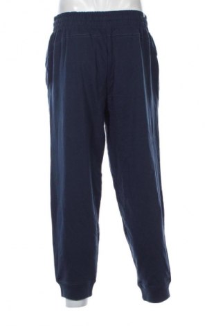 Męskie spodnie sportowe PUMA, Rozmiar XL, Kolor Niebieski, Cena 290,99 zł