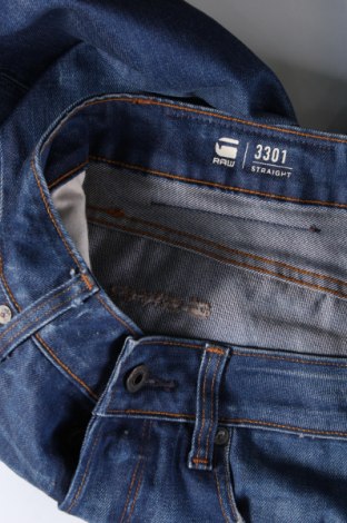 Męskie jeansy G-Star Raw, Rozmiar M, Kolor Niebieski, Cena 594,02 zł