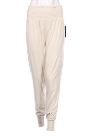 Γυναικείο αθλητικό παντελόνι Blacc, Μέγεθος L, Χρώμα  Μπέζ, Τιμή 14,23 €