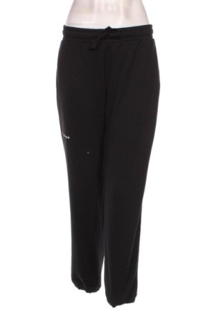 Γυναικείο αθλητικό παντελόνι New Balance, Μέγεθος M, Χρώμα Μαύρο, Τιμή 26,91 €