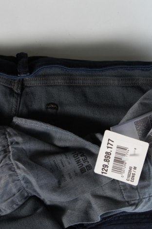 Męskie jeansy Uniqlo, Rozmiar L, Kolor Niebieski, Cena 247,18 zł