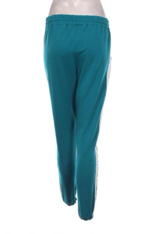 Damskie spodnie sportowe Adidas Originals, Rozmiar M, Kolor Zielony, Cena 131,99 zł