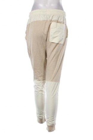 Damskie spodnie sportowe Nike, Rozmiar S, Kolor Beżowy, Cena 154,99 zł
