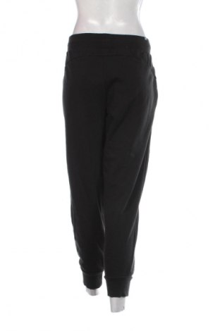 Γυναικείο αθλητικό παντελόνι PUMA, Μέγεθος L, Χρώμα Μαύρο, Τιμή 23,99 €
